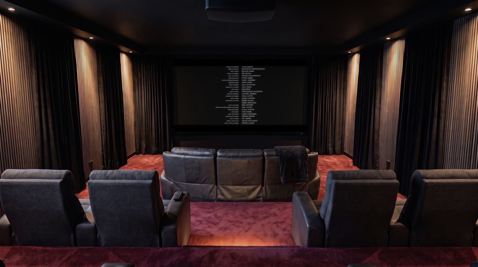 Heimkino, Licht halb an, der Abspann rollt weiter im 21:9-Bild, die Maskierung deckt oben und unten ab (Symbolbild)